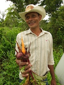 Nicaraguan farmer with vegetables from his greenhouse